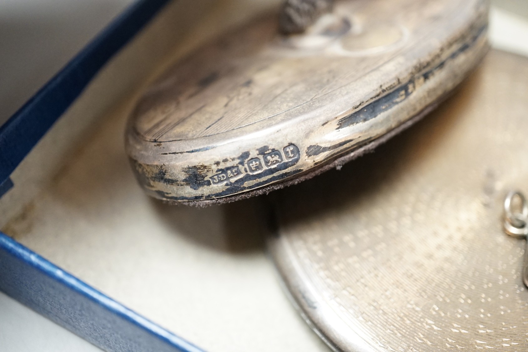 A 1930' silver and green enamel mounted compact, a silver mounted ring tree and two early 20th century silver 'envelope' stamp cases, one with enamel.